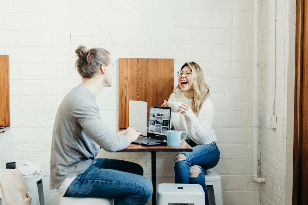 Couple Sitting On The Dining Table